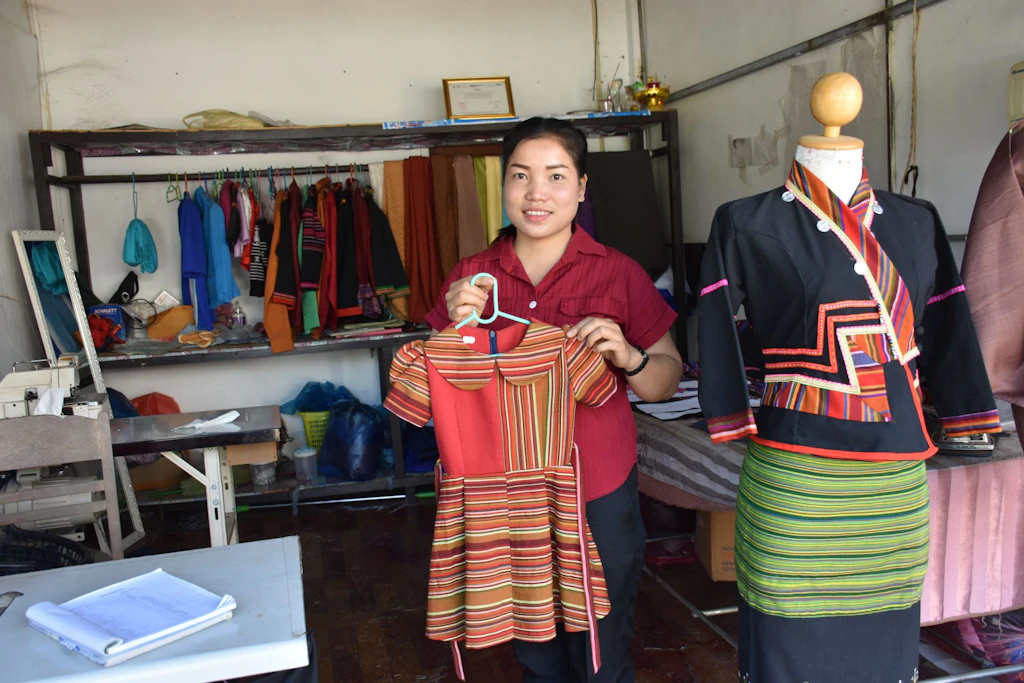 Ms. Lone, a local tailor and beneficiary of vocational training in Laos